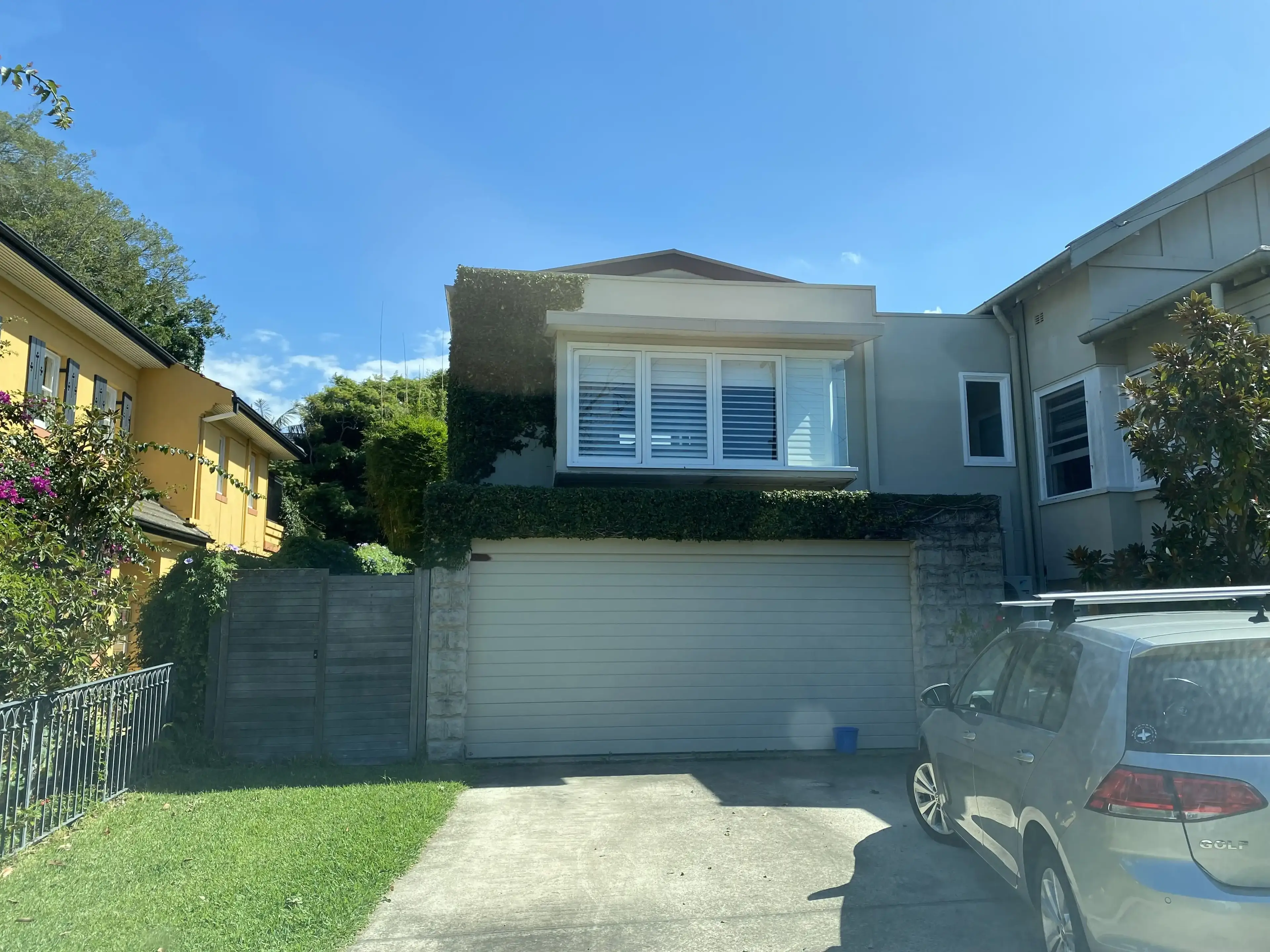 Hedge trimmed above a garage